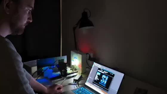 David testing a prototype optical setup late in the lab