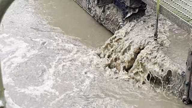 Turbid wastewater discharging into a treatment channel