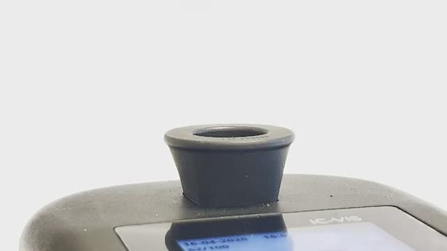 A cuvette being lowered into the IC-VIS™ cuvette port
