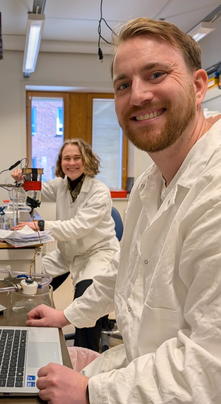 Two researchers in lab coats at Lund University during a measurement campaign on emulsions
