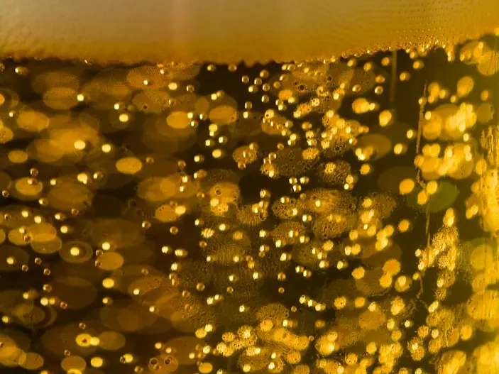 clear drinking glass with beer