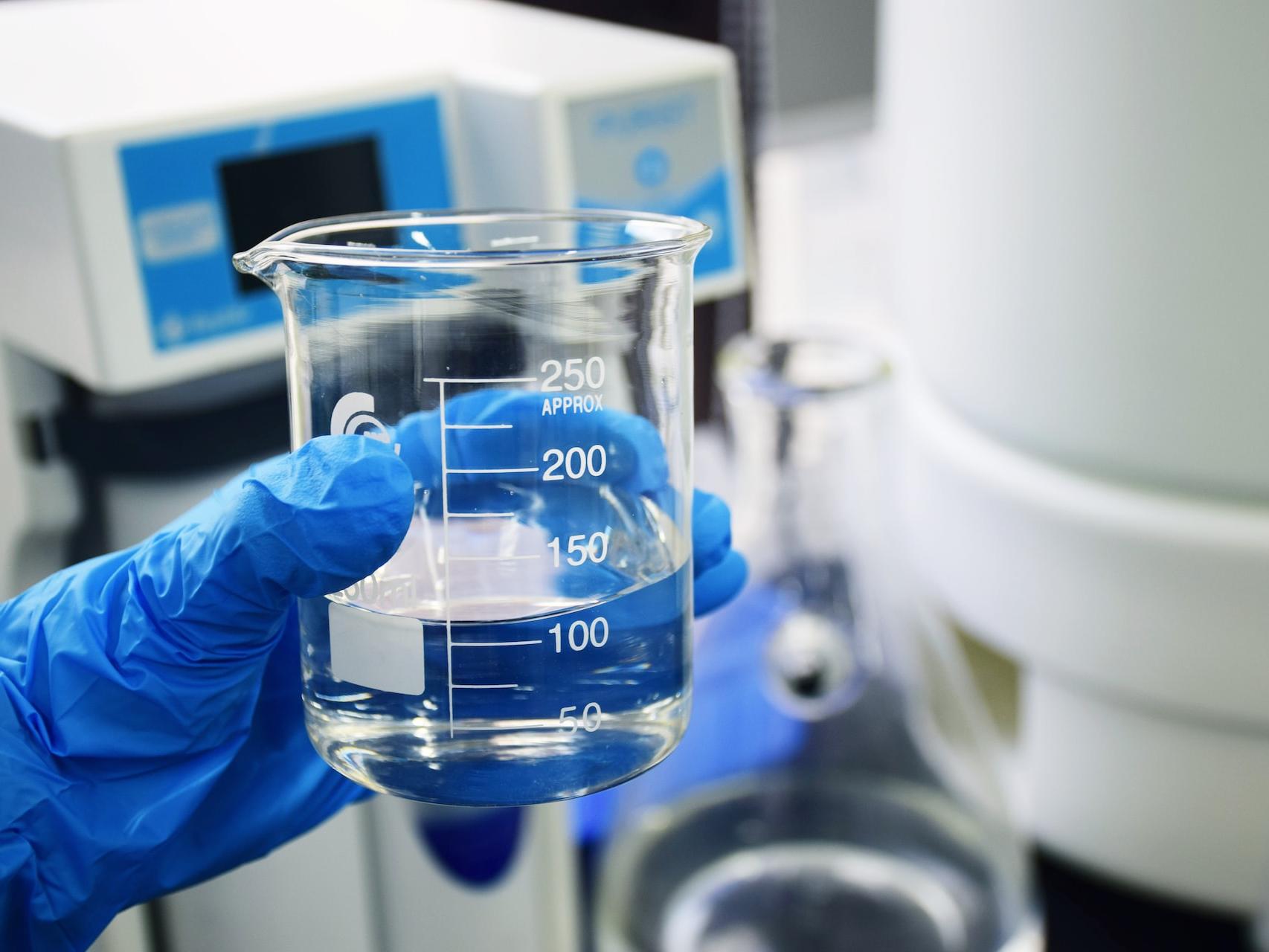 clear glass measuring cup on white table